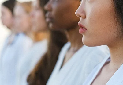 A diverse group of professional women in profile, symbolizing inclusive employment opportunities and workforce equality